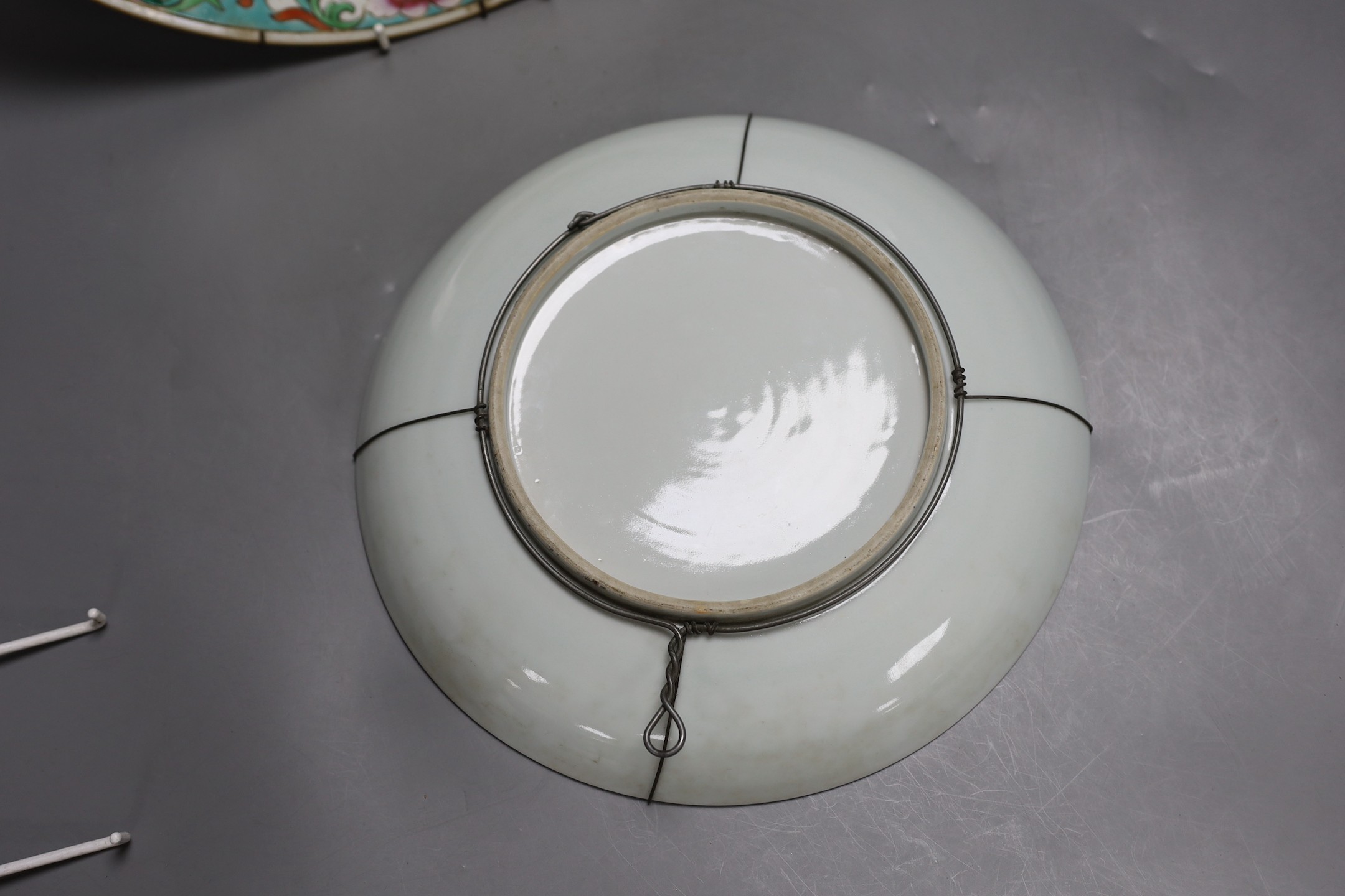 An early 20th century Chinese famille rose charger (a.f) and a Chinese famille verte dish. Largest 36cm